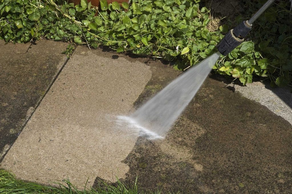 Pressure washing sidewalk
